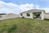 Spacious backyard with covered patio&mdash;perfect for lounging or entertaining.