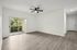 interior pic of deluxe unit living room with gray planking and white walls