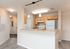 Open-concept kitchen with breakfast bar.