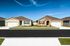 Charming single-story homes with private driveways and manicured lawns.