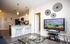 Modern open-concept living space with sleek finishes and natural light.
