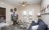 Cozy living area with private balcony access and plenty of natural light.