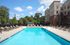 Resort-style swimming pool with sundeck.