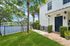 Waterfront townhomes with a lush garden, private entrance, and picturesque lake views.