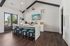 Chic modern kitchen with a breakfast bar, stylish pendant lighting, and vibrant outdoor views.