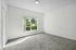 interior pic of bedroom with plush light gray carpeting, LED fixture and large windo