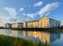 Lakeside view of apartment and grounds