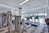 The fitness center at our senior living community in Denver, CO, featuring treadmills and weight lifting machines.
