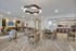 Resident lounge at our senior living community in Denver, CO, featuring a long dining table and elegant decor.