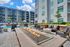 The pool area at our senior living community in Denver, CO, featuring beach chairs and an outdoor rooftop lounge.