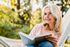 Women reading book on hammock