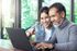 Man and women looking at laptop