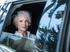 Lady in car looing out window