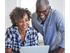 Couple looking at laptop