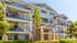 The entrance to the Elate Rancho Cucamonga senior living community, featuring a entrance way and a view of the balconies.