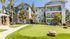 The putting green at our senior living apartments in Rancho Cucamonga, CA, featuring a view of the apartment exteriors.