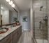 Bathroom with standing shower and vanity