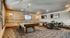 Chic recreational room featuring a stylish billiards table, cozy seating area, and modern wall art, perfect for entertaining.