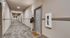 Welcoming apartment hallway with stylish decor and a friendly 'Home Sweet Home' doormat.
