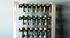 Sleek gym equipment rack showcasing a range of colorful dumbbells in a modern fitness studio.