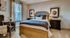 Cozy and elegant bedroom with stylish decor, featuring a comfortable bed, soft lighting, and charming accent pieces.