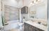 Shower-tub and vanity in bathroom at senior living community in Chapel Hill