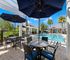 Swimming pool view with sitting area