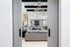 Inviting open living area featuring modern gray sofas, stylish lighting, and elegant d&eacute;cor for a luxurious ambiance.