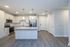 Contemporary kitchen with sleek cabinetry, modern stainless steel appliances, granite countertops, and elegant pendant lighting.