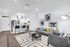 Modern kitchen and living area featuring sleek white cabinetry, granite countertops, and stainless steel appliances, illuminated by stylish pendant lights and natural light from large windows.
