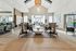 Elegant and spacious community lounge with high ceilings, modern decor, and comfortable seating areas, perfect for socializing and relaxation.