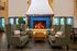 A fire place located in the large club house for a warm gathering