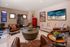 A room with a table and sofas for gathering