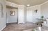 Chic living room corner featuring tasteful decor, modern flooring, and soft neutral walls.