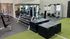 Spacious, modern gym with diverse fitness equipment and mirrored walls creating an energizing workout environment.