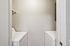 Efficient laundry room with modern washer and dryer, optimized for convenience.