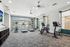Modern fitness center with state-of-the-art gym equipment, large windows, and stylish design in a bright, airy space.