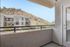 Inviting balconies with stunning hillside views, promising serene outdoor relaxation.