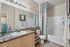 Elegant bathroom with modern fixtures, and decorative accents providing a luxurious feel.