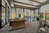 Luxurious open-concept living space with modern decor, featuring high ceilings, elegant furnishings, and abundant natural light.