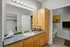 Elegant bathroom with modern lighting, spacious vanity, and contemporary decor.