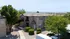 Charming apartment exterior surrounded by lush greenery and mountain views, featuring modern architectural design.