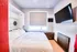 Queen-sized murphy bed in a micro-unit modern apartment