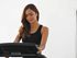Female stand on exercise treadmill doing cardio.