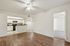 Inviting open-concept apartment with elegant hardwood floors, modern kitchen, and bright spacious rooms.