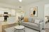 Contemporary open-concept living area with stylish kitchen and cozy seating, perfect for modern comfort and entertaining.