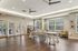Bright and airy communal space with modern furniture, large windows, and chic decor, perfect for gatherings and relaxation.