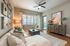 Chic and inviting living room with stylish decor, cozy sectional sofa, and contemporary wooden furniture, bathed in natural light.