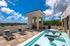 Luxurious rooftop terrace with stunning city views, featuring a chic lounge area and a modern splash pool for relaxation.
