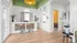 Chic apartment lobby with elegant design, featuring a modern bar area, stylish decor, and bright natural lighting.